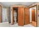 Bathroom with tile shower and toilet behind a partial wall at 3310 Tall Timber Dr, Orlando, FL 32812