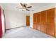 Bedroom featuring a closet and a wood-look entry door at 3310 Tall Timber Dr, Orlando, FL 32812