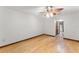 Bright bedroom with hardwood floors, neutral walls, and ceiling fan at 3310 Tall Timber Dr, Orlando, FL 32812