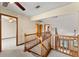 Second story landing with railing overlooking the main floor at 3310 Tall Timber Dr, Orlando, FL 32812