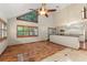 Bright living room features vaulted ceilings, skylights, and sleek hardwood floors at 3310 Tall Timber Dr, Orlando, FL 32812