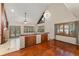 Bright living room with vaulted ceilings, wood floors, and built-in cabinets at 3310 Tall Timber Dr, Orlando, FL 32812