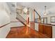 Bright and open living room featuring hardwood floors, stairs, and a chandelier at 3310 Tall Timber Dr, Orlando, FL 32812