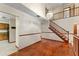 Bright and open living room featuring hardwood floors, stairs, and a chandelier at 3310 Tall Timber Dr, Orlando, FL 32812