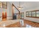 Spacious living room with fireplace, high ceilings, and access to the outdoor patio at 3310 Tall Timber Dr, Orlando, FL 32812