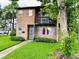 Charming two-story brick home with a balcony and well-maintained front lawn at 5084 Downing St # 2, Orlando, FL 32839