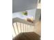 View from the top of a staircase overlooking a living area with a fireplace and neutral tile floors at 5084 Downing St # 2, Orlando, FL 32839