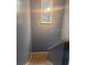 Interior shot of a carpeted staircase with light gray walls and a decorative mirror at 5084 Downing St # 2, Orlando, FL 32839