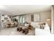 Open-concept living space with kitchen island seating, dining area and living room with bright, neutral decor at 5277 Bowspirit Way, St Cloud, FL 34771
