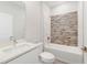 A bathroom features a shower with decorative wall tiles at 109 Violet Ct, Kissimmee, FL 34759