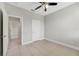 A bedroom features neutral walls and a door at 109 Violet Ct, Kissimmee, FL 34759