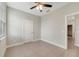A compact bedroom features neutral walls and a door at 109 Violet Ct, Kissimmee, FL 34759