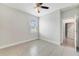 Neutral bedroom with light-colored tile flooring, a ceiling fan, and a window with horizontal blinds at 109 Violet Ct, Kissimmee, FL 34759