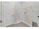 A clean laundry room with a utility sink and a single wire rack above the appliances at 109 Violet Ct, Kissimmee, FL 34759