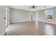 Bright living room featuring tile flooring and ceiling fan at 109 Violet Ct, Kissimmee, FL 34759