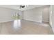 Large living room with neutral paint and sliding glass doors at 109 Violet Ct, Kissimmee, FL 34759
