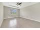 Spacious main bedroom featuring a ceiling fan and natural light at 109 Violet Ct, Kissimmee, FL 34759