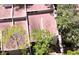 Birds-eye view of condo roofs surrounded by mature trees, showcasing a peaceful and private community setting at 209 Fairway Dr # 209, Longwood, FL 32779
