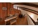 Lofted space featuring wood paneling, exposed beams, and a piano at 209 Fairway Dr # 209, Longwood, FL 32779