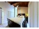 View of the bedroom with wood ceiling, closets, and a king bed at 209 Fairway Dr # 209, Longwood, FL 32779