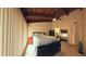 Bedroom featuring wood ceiling, a king bed and lots of light from the windows at 209 Fairway Dr # 209, Longwood, FL 32779