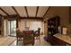 Bright dining area with a large window, marble table and exposed beam ceiling at 209 Fairway Dr # 209, Longwood, FL 32779