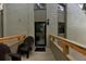 Inviting front porch with seating, leads to the front door with black trim, adding character to the home's entrance at 209 Fairway Dr # 209, Longwood, FL 32779