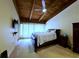 View of the main bedroom with wood ceiling and a king size bed at 209 Fairway Dr # 209, Longwood, FL 32779