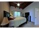 Cozy main bedroom featuring wood ceiling, sliding doors and television at 209 Fairway Dr # 209, Longwood, FL 32779