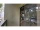 A view from the patio through sliding glass doors into the living room at 209 Fairway Dr # 209, Longwood, FL 32779