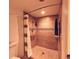 Shower featuring a shower niche, tiled walls and a towel rack at 209 Fairway Dr # 209, Longwood, FL 32779