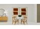 Bright dining area with modern table, seating for four, and stylish decor at 3007 Maloof Dr, Davenport, FL 33837