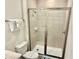 Bathroom showcases a tiled shower, wood-look flooring and neutral colors at 3117 Caribbean Soul Dr, Kissimmee, FL 34747