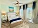 Inviting bedroom with soft colors, a comfortable bed, and large windows offering plenty of natural light at 3117 Caribbean Soul Dr, Kissimmee, FL 34747