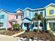 Charming colorful townhomes with well-maintained landscaping, enhancing curb appeal and comfort at 3117 Caribbean Soul Dr, Kissimmee, FL 34747