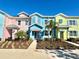 Charming colorful townhomes with well-maintained landscaping, enhancing curb appeal and comfort at 3117 Caribbean Soul Dr, Kissimmee, FL 34747