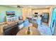 Bright living room showing kitchen, island, modern furnishings, and stylish decor at 3117 Caribbean Soul Dr, Kissimmee, FL 34747