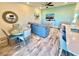 Inviting view of living room, dining area and kitchen with island and bar seating at 3117 Caribbean Soul Dr, Kissimmee, FL 34747