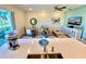 Open-concept living room with modern furnishings, dining area, and bright decor at 3117 Caribbean Soul Dr, Kissimmee, FL 34747