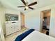 A light-filled main bedroom featuring a ceiling fan, dresser, and a TV for a relaxing experience at 3117 Caribbean Soul Dr, Kissimmee, FL 34747