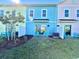A private patio with colorful Adirondack chairs, perfect for outdoor relaxation and entertaining at 3117 Caribbean Soul Dr, Kissimmee, FL 34747