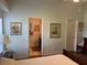 Light-filled bedroom leading to an en-suite bathroom and closet at 4012 Capland Ave, Clermont, FL 34711