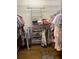 Walk-in closet with wire shelving, providing plenty of storage for clothes and accessories at 4012 Capland Ave, Clermont, FL 34711