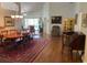 Elegant dining room with hardwood floors and beautiful chandelier at 4012 Capland Ave, Clermont, FL 34711