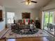 Inviting living room with comfortable seating and natural light, perfect for relaxation at 4012 Capland Ave, Clermont, FL 34711