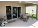Outdoor patio with a dining table, chairs, and sliding glass doors to the interior at 4012 Capland Ave, Clermont, FL 34711