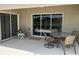 Spacious outdoor patio with dining furniture and a view of the landscaped yard at 4012 Capland Ave, Clermont, FL 34711