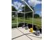Serene screened-in porch overlooking a well-maintained lawn and greenery at 4012 Capland Ave, Clermont, FL 34711