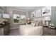 Comfortable bedroom featuring a large window, a desk, and tasteful decor at 5283 Bowspirit Way, St Cloud, FL 34771