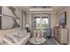 Cozy living room with neutral furniture, patterned curtains, and bright lighting at 5295 Bowspirit Way, St Cloud, FL 34771